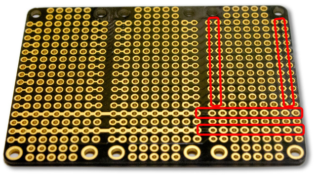 The bare FeatherWing Tripler board, rows of gold pads on black, with red outlines around strips of connected pads.