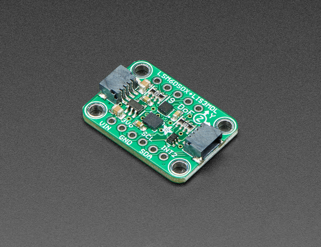 The LSM6DSOX + LIS3MDL board at an angle: a small green board labelled "LSM6DSOX+LIS3MDL 9 DoF", two sensor chips in the middle, a STEMMA QT connector at each end, and pins labelled VIN, 3Vo, GND, SCL, SDA and INT2 along one edge.