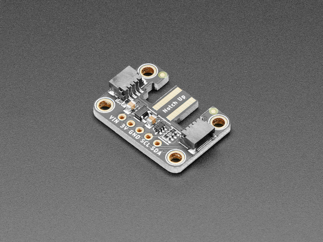The Wii Nunchuck breakout adapter: a small black board with a tab marked "Notch Up" and two STEMMA QT connectors.