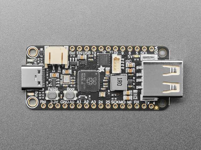 The Adafruit Feather RP2040 with USB Type A Host board, a USB-A socket at one end.